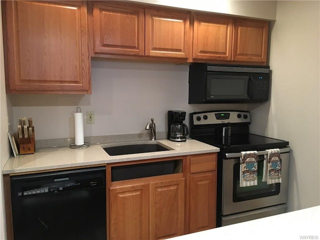 kitchen with black appliances and sink