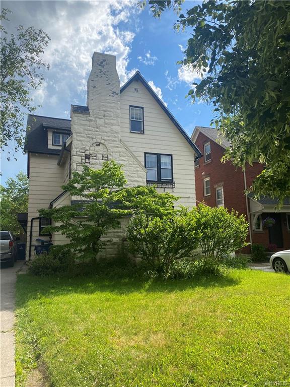 view of home's exterior with a yard