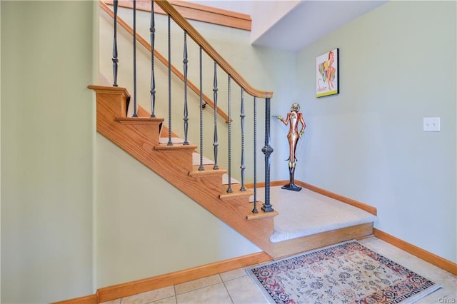 stairway with light tile floors