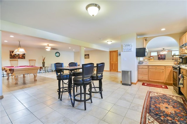 tiled dining area featuring bar, billiards, and ceiling fan