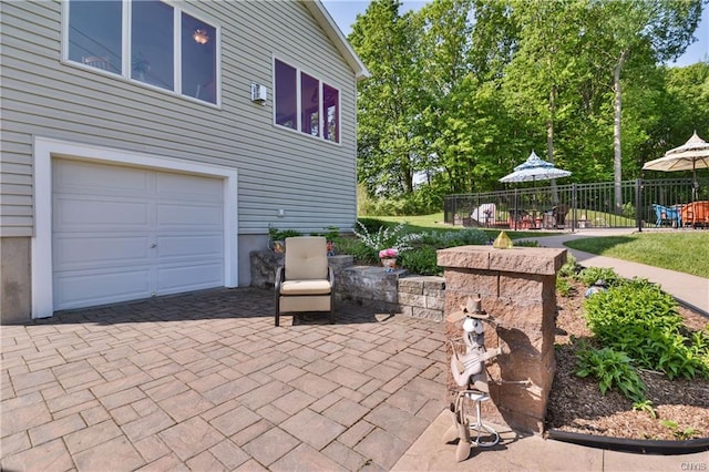 view of patio featuring a garage