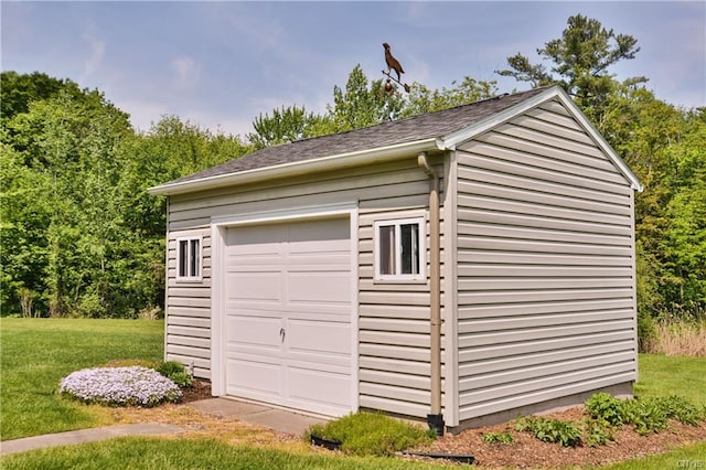 garage with a yard