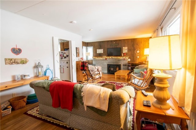 living room with wooden walls and hardwood / wood-style floors