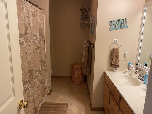 bathroom with tile flooring and vanity