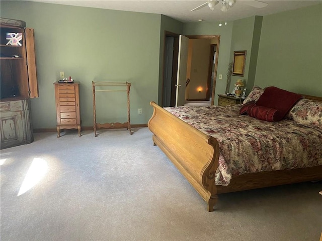 bedroom featuring ceiling fan and light colored carpet