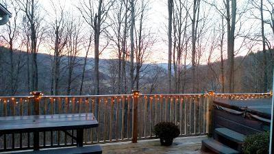 exterior space featuring a deck with mountain view