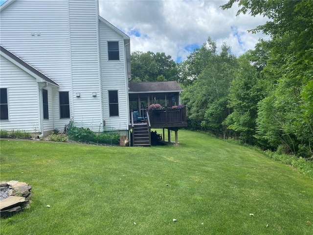 view of yard featuring a wooden deck