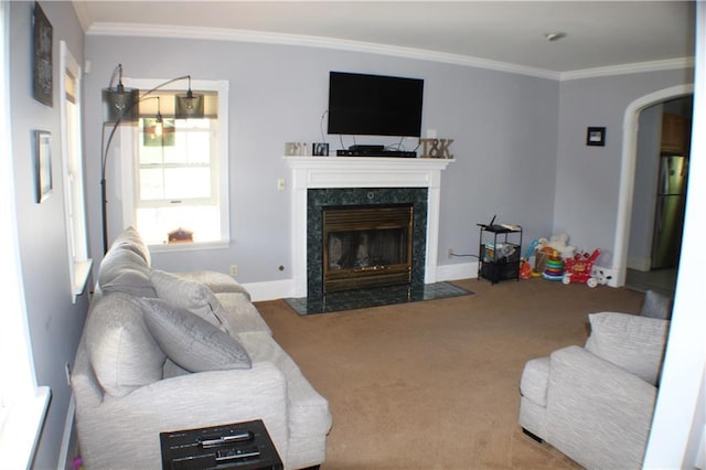 carpeted living room with crown molding and a fireplace