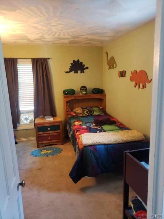 bedroom featuring carpet