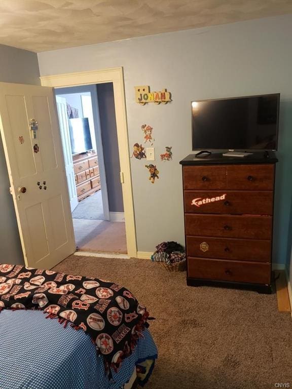 bedroom featuring light colored carpet