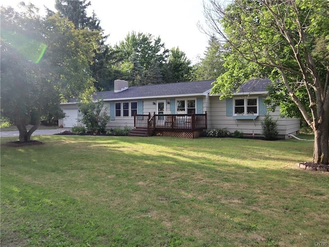 single story home with a wooden deck and a front yard