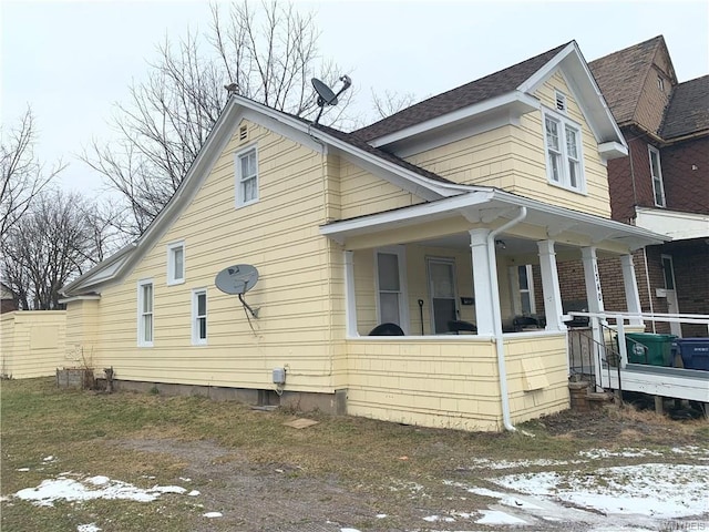 view of home's exterior with a porch