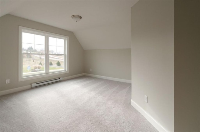 bonus room with vaulted ceiling, light colored carpet, and a baseboard radiator