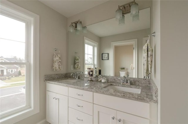 bathroom with dual vanity