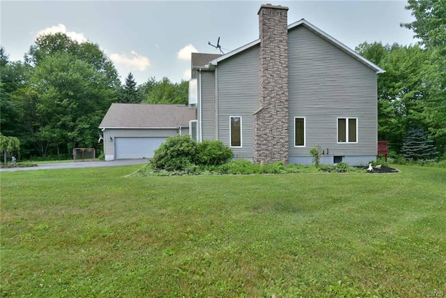 exterior space featuring a front lawn and a garage