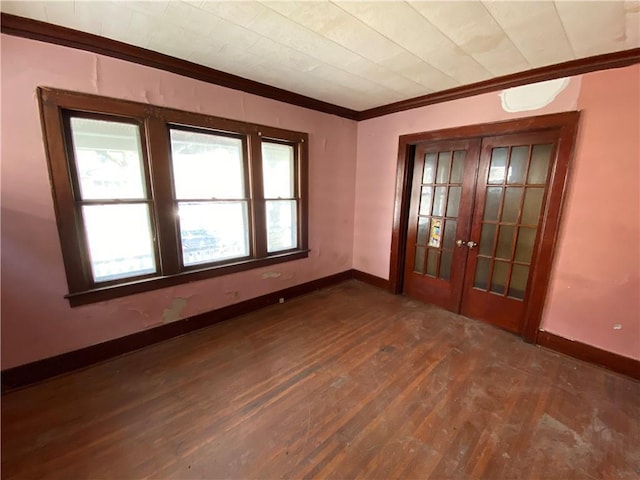 spare room with dark hardwood / wood-style flooring and french doors