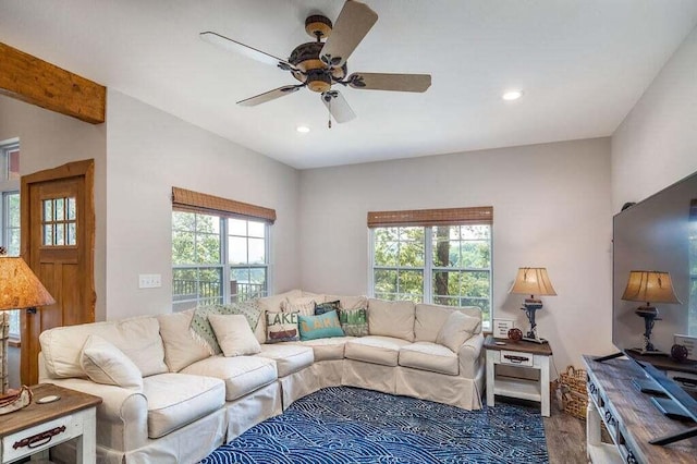 living room featuring ceiling fan, hardwood / wood-style flooring, and a wealth of natural light