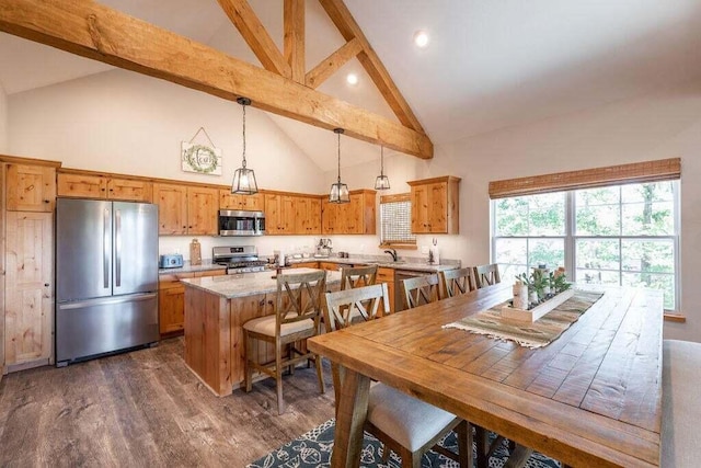 dining space featuring dark hardwood / wood-style floors, high vaulted ceiling, sink, and beamed ceiling