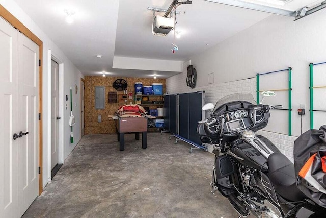 garage featuring a garage door opener and electric panel