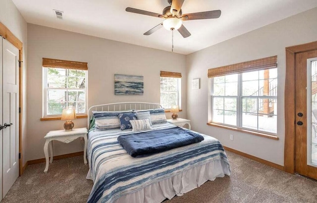 bedroom with ceiling fan and carpet flooring