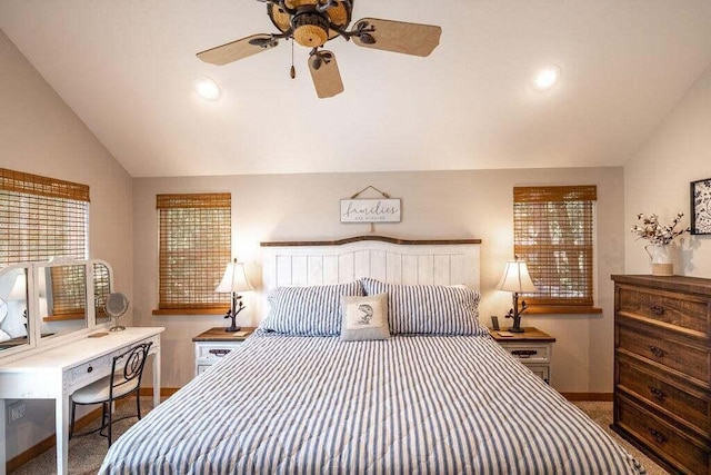 bedroom with lofted ceiling, dark colored carpet, and ceiling fan