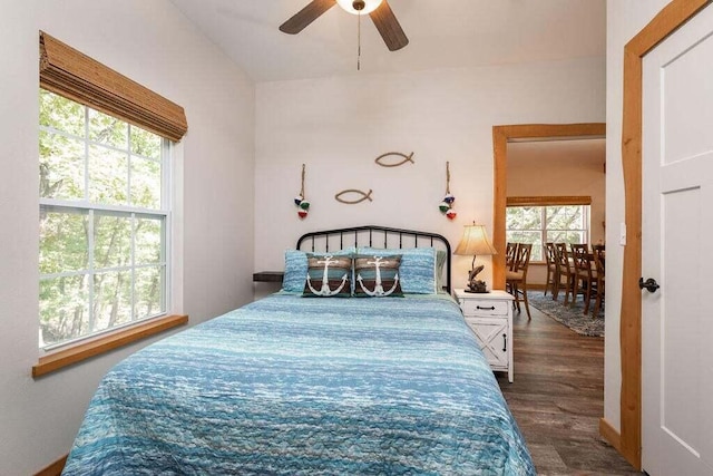 bedroom with ceiling fan and dark hardwood / wood-style floors