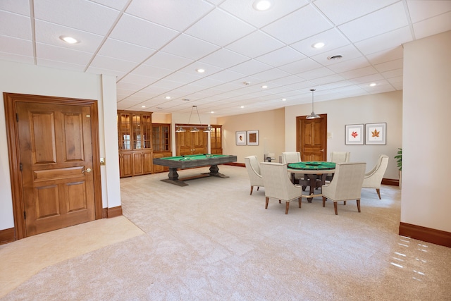 recreation room with light carpet, billiards, and a drop ceiling