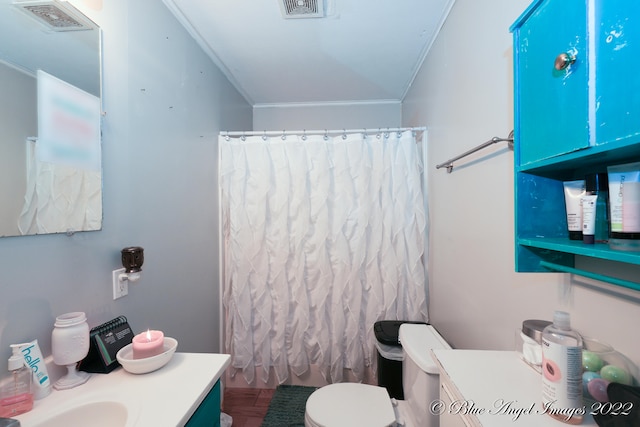 bathroom with a shower with curtain, vanity, crown molding, and toilet