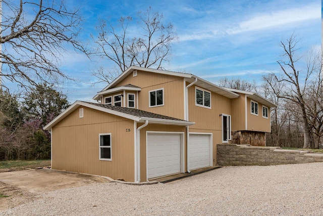 view of side of property with a garage