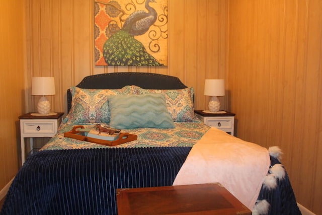 bedroom with wooden walls