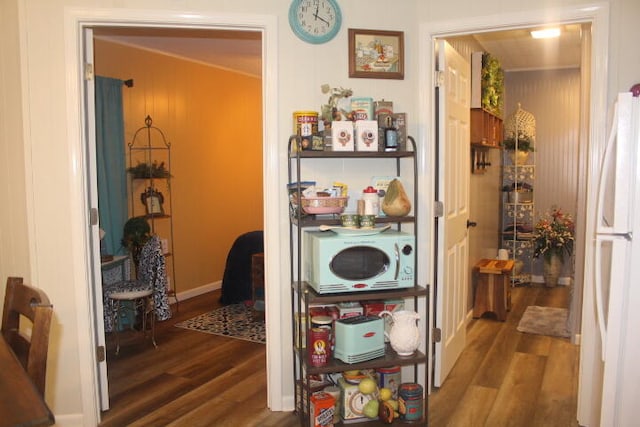 hall with dark hardwood / wood-style flooring