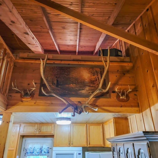 room details with beam ceiling, wood walls, and white microwave