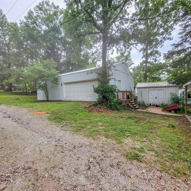 exterior space with a yard and a storage unit