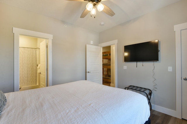 bedroom featuring ceiling fan, connected bathroom, and dark hardwood / wood-style floors