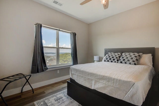 bedroom with wood-type flooring and ceiling fan