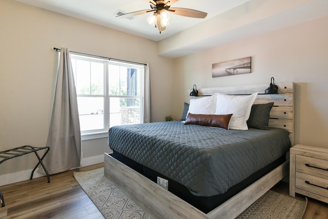 bedroom featuring ceiling fan and hardwood / wood-style floors