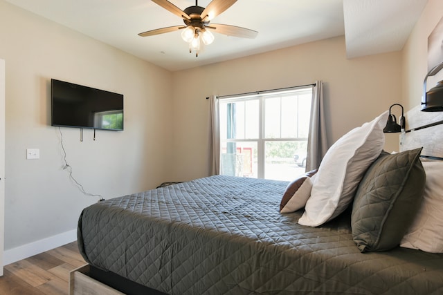 bedroom featuring wood-type flooring and ceiling fan