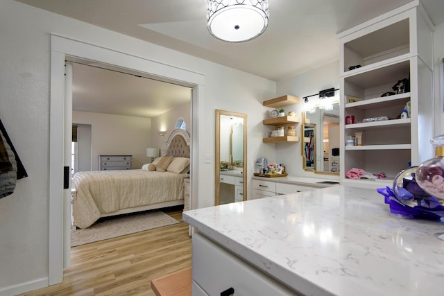 bedroom featuring light wood-type flooring