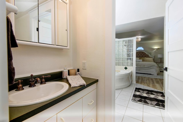 bathroom featuring tile patterned flooring and vanity