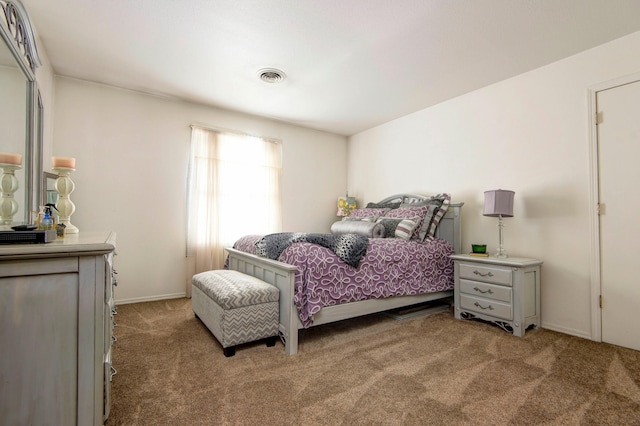 bedroom featuring light colored carpet