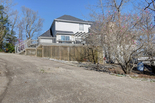 view of home's exterior featuring a deck