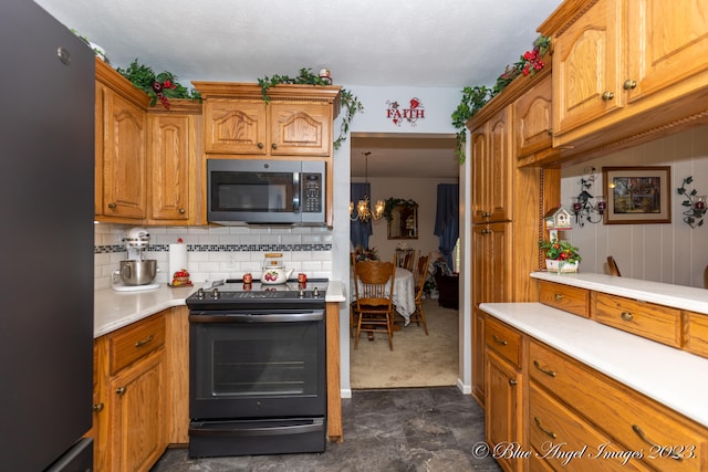 kitchen with black appliances and decorative backsplash