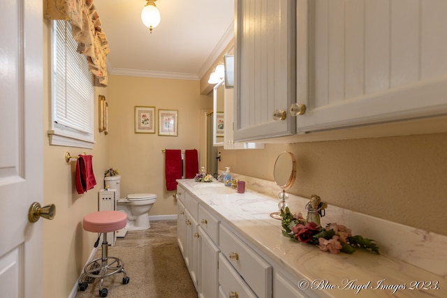 bathroom with crown molding, vanity, and toilet