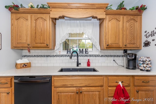 kitchen with tasteful backsplash, black dishwasher, and sink