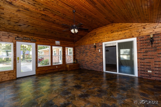 unfurnished sunroom featuring ceiling fan, wood ceiling, and lofted ceiling