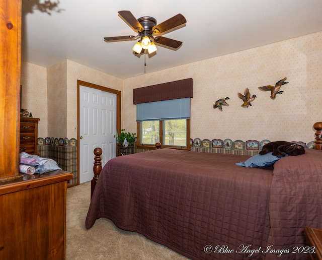 carpeted bedroom featuring ceiling fan