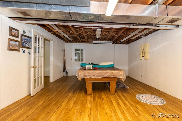 game room with wood-type flooring and billiards