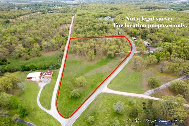 4565 State Route Cc, West Plains, MO 65775 - drone / aerial view with a wooded view