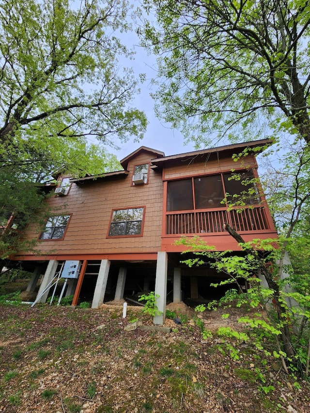 rear view of property with a sunroom