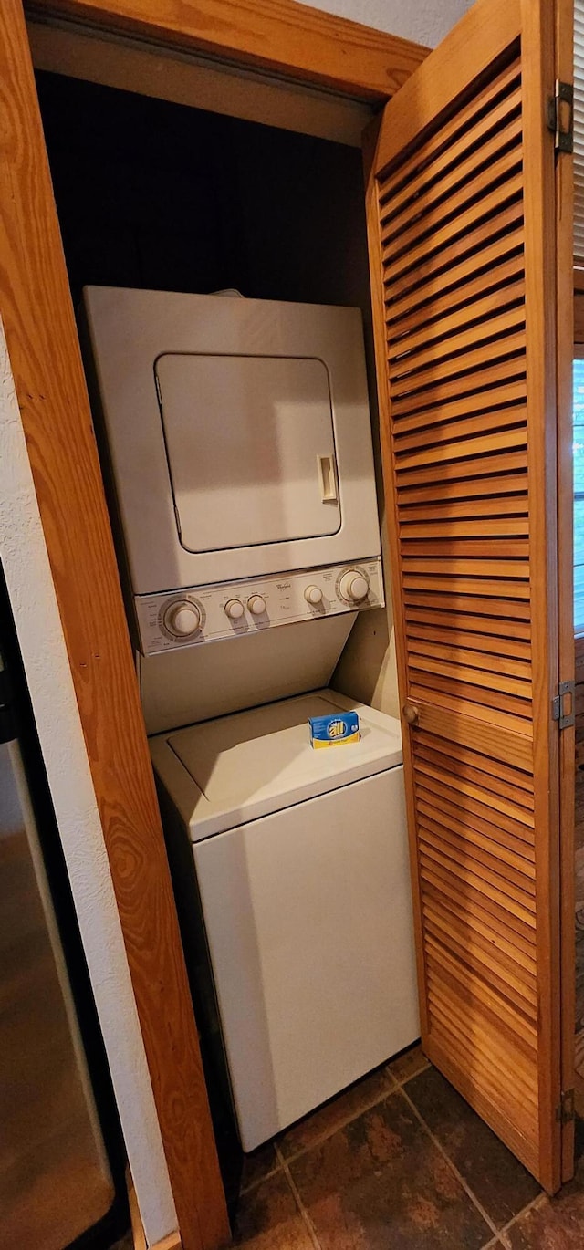 laundry room featuring stacked washing maching and dryer